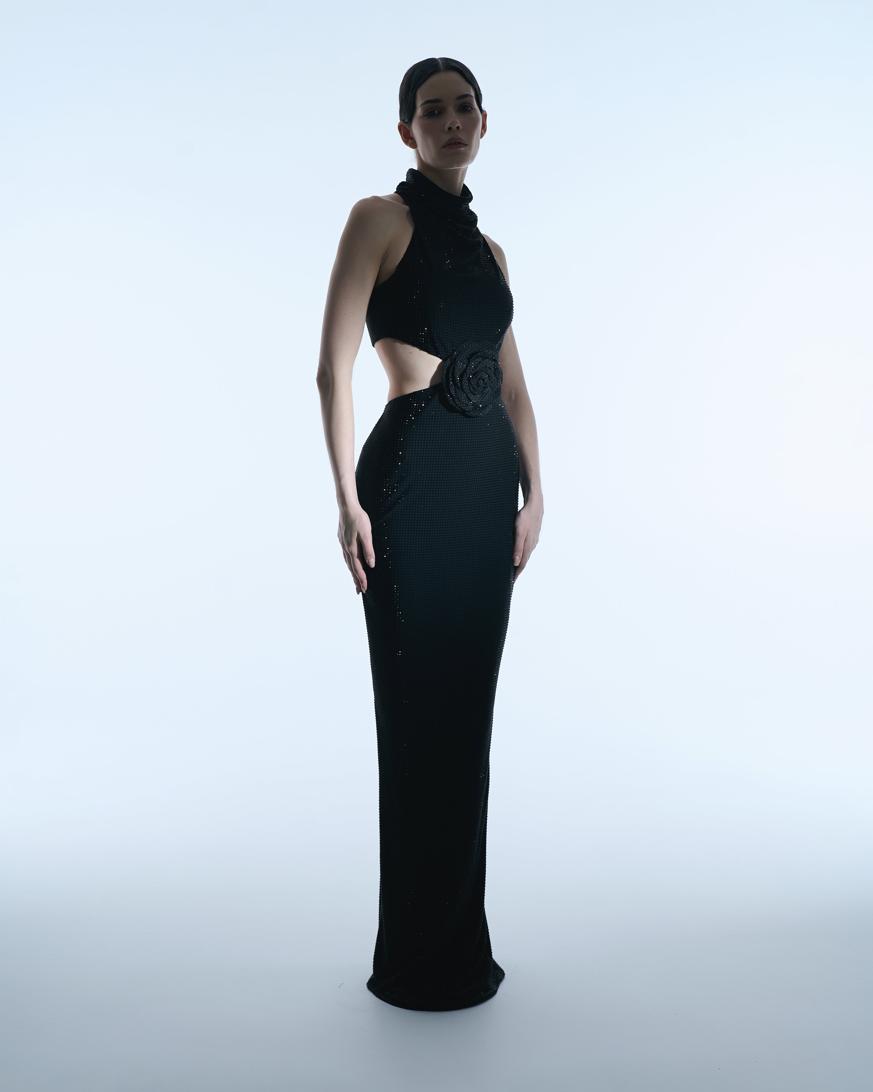 Black halter gown with floral waist detail