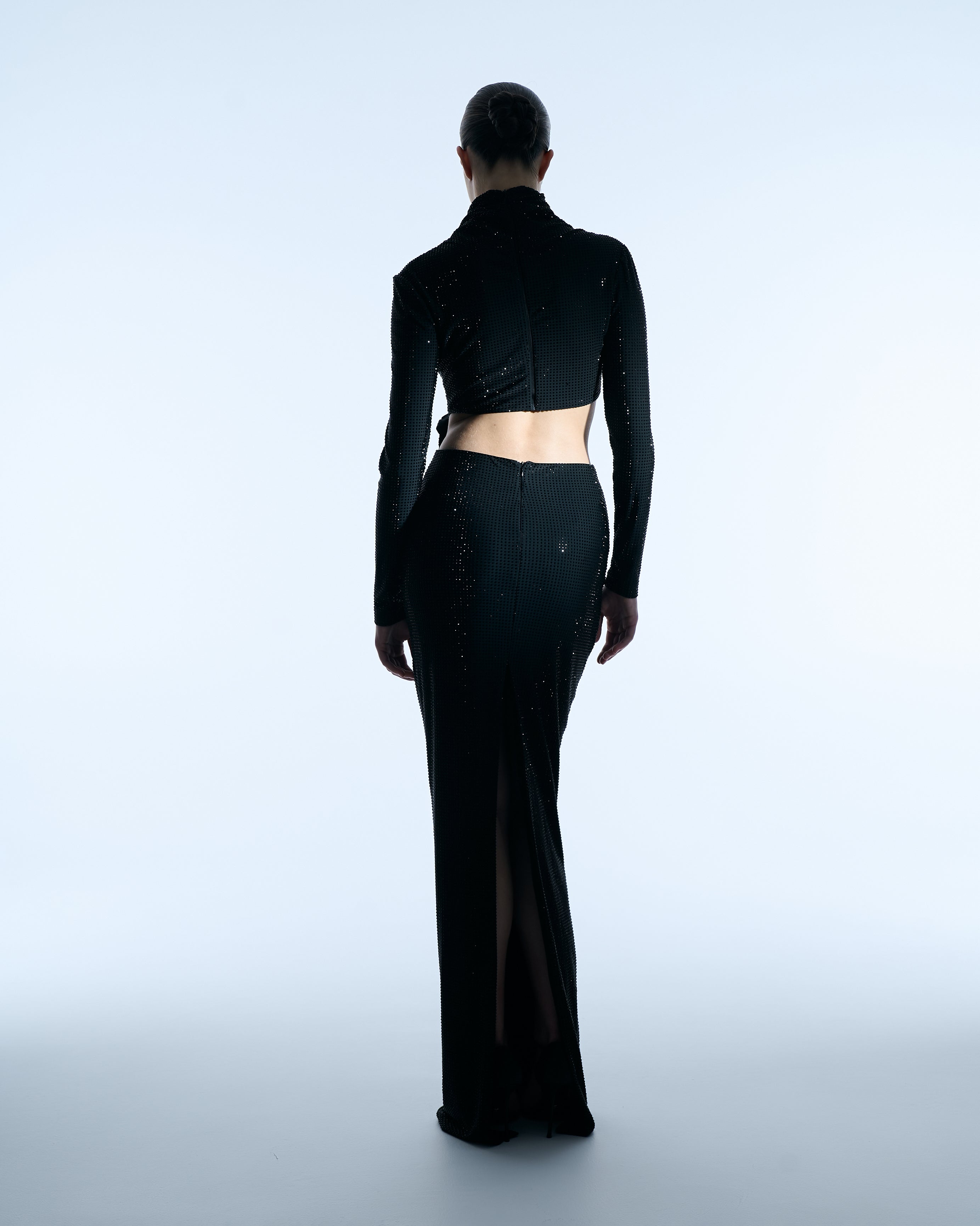 Black long-sleeve gown with floral waist detail