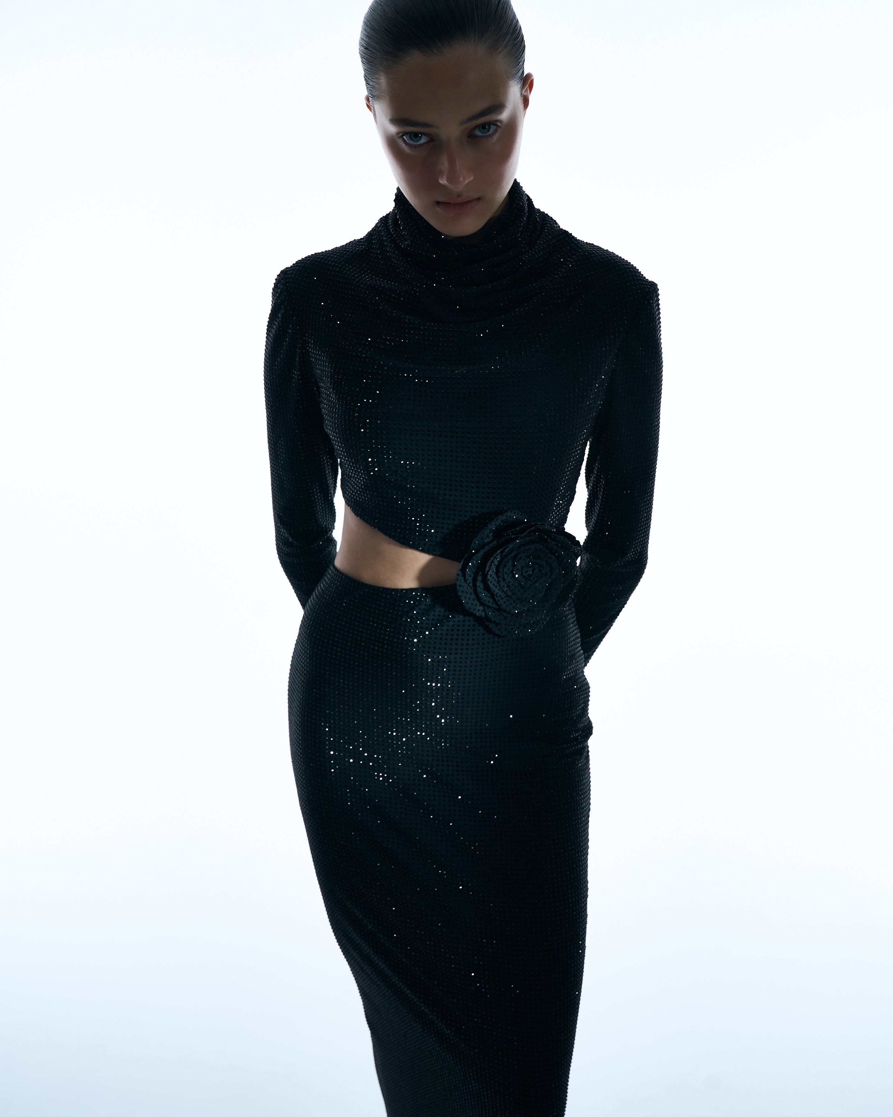 Black long-sleeve gown with floral waist detail