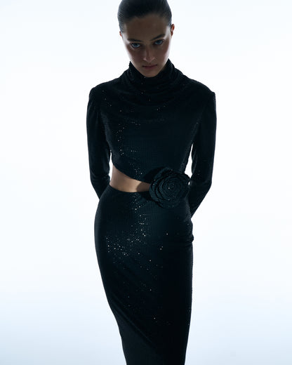 Black long-sleeve gown with floral waist detail