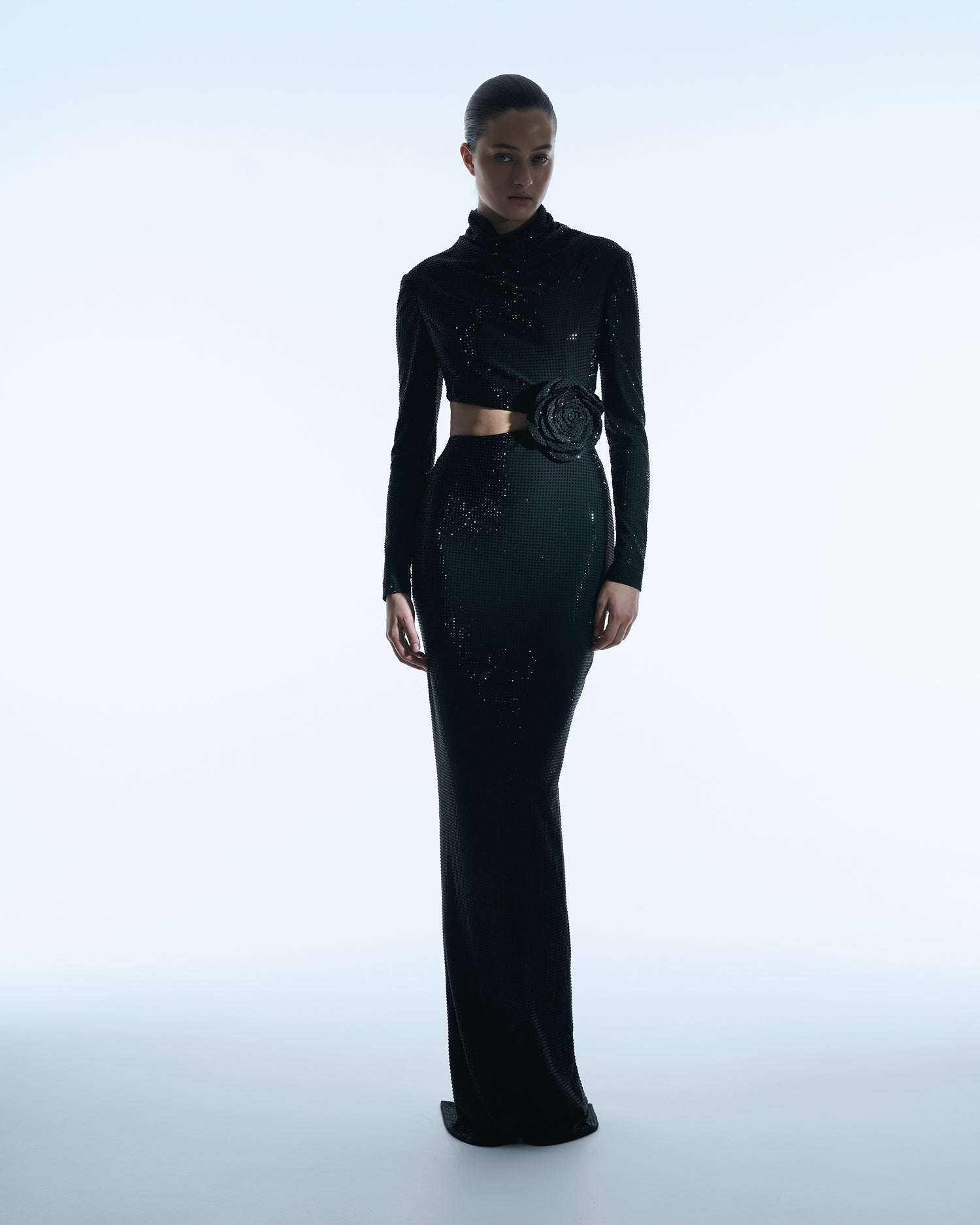 Black long-sleeve gown with floral waist detail