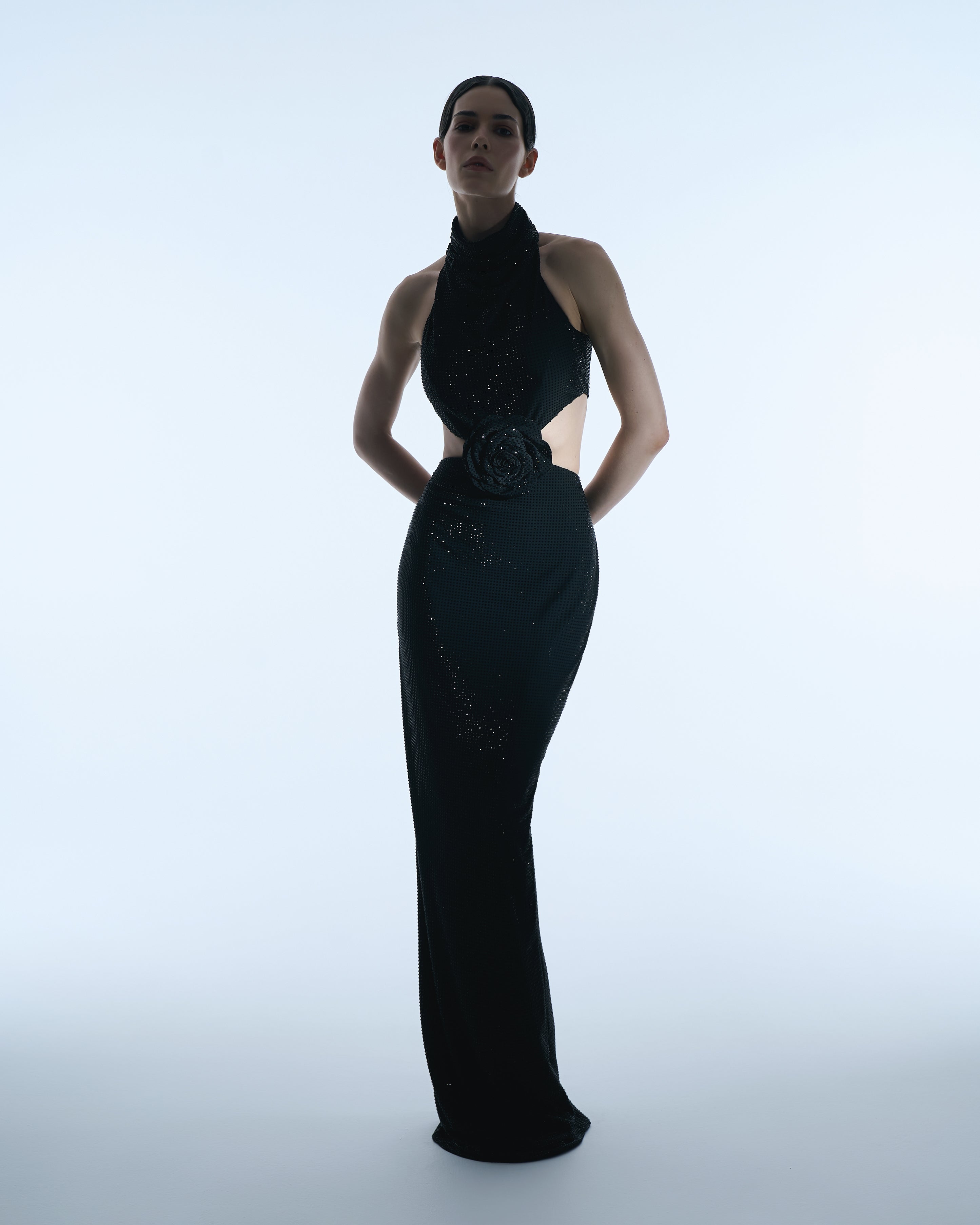 Black halter gown with floral waist detail