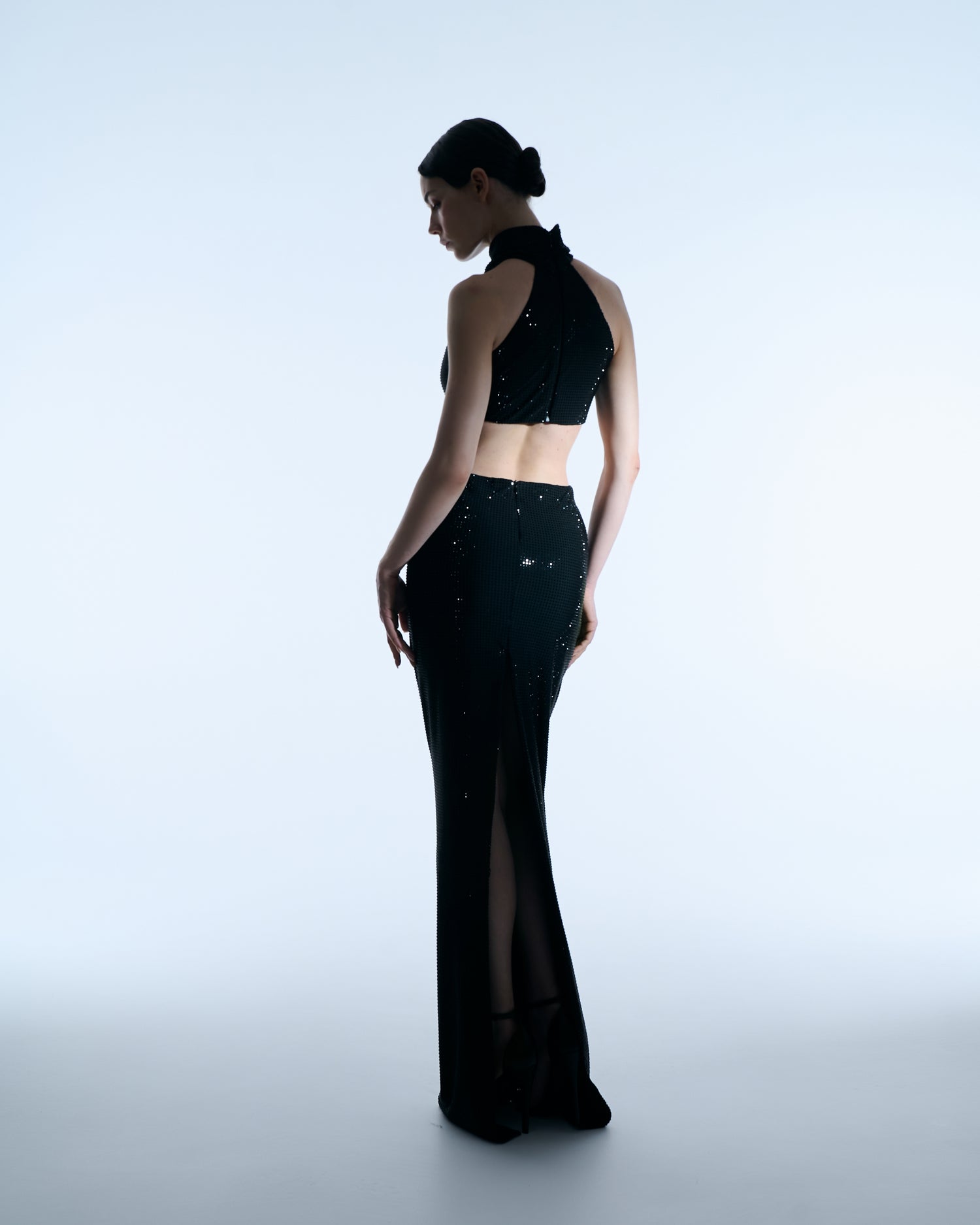 Black halter gown with floral waist detail