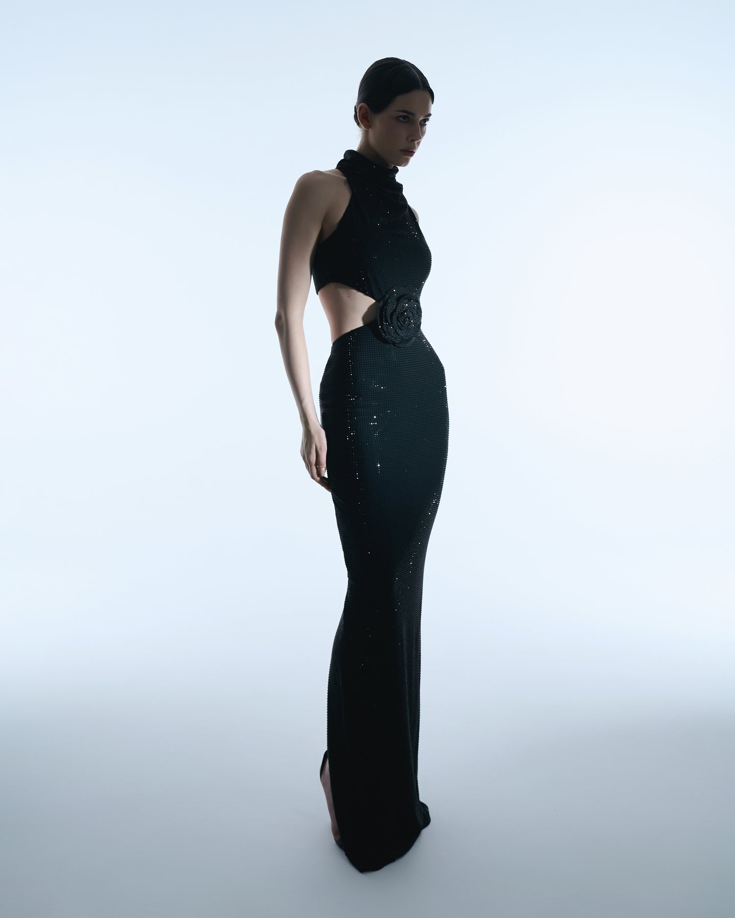 Black halter gown with floral waist detail