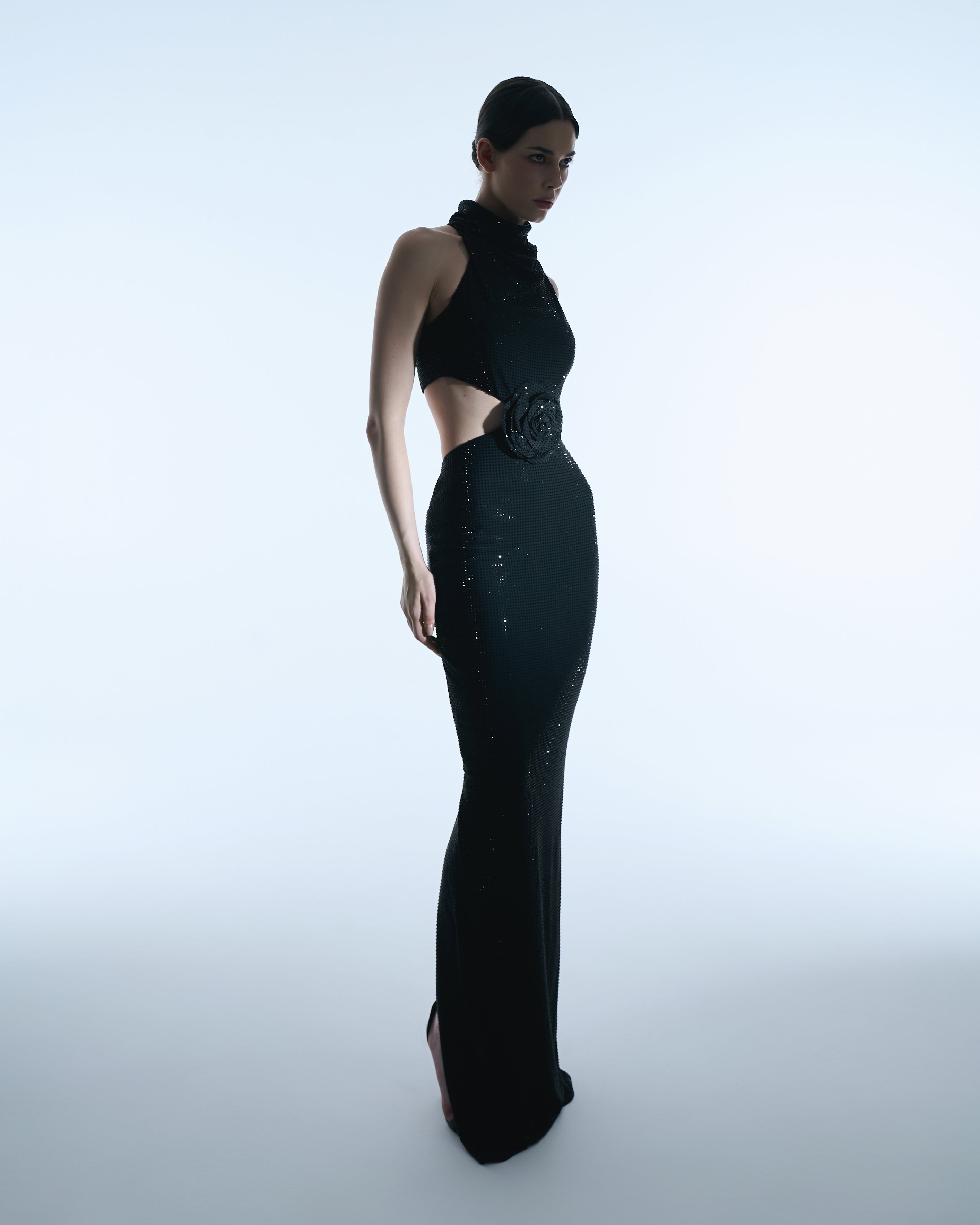 Black halter gown with floral waist detail